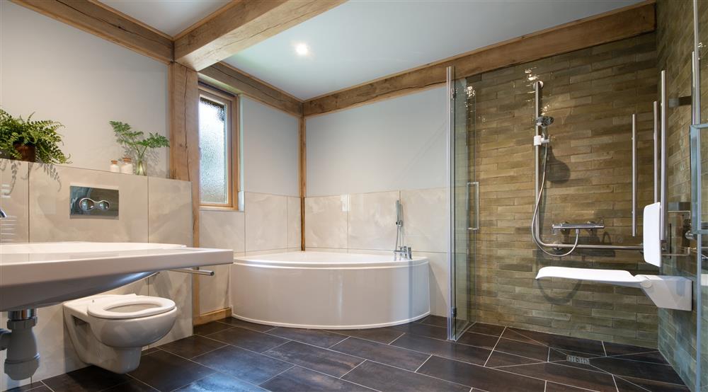 The ground-floor, en-suite bathroom at 1 Bagden Farm Cottage in Dorking, Surrey