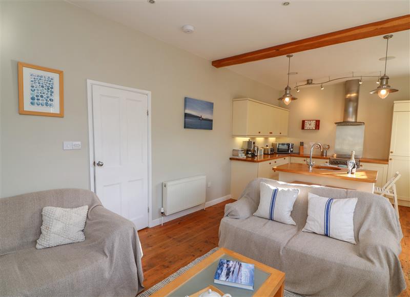Relax in the living area at 1 Baileys Cottage, Stoke Fleming