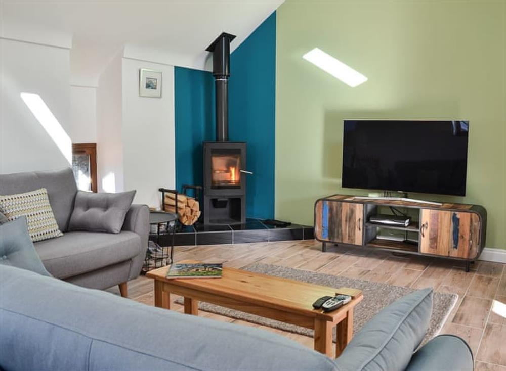 Living room with wood burner (photo 2) at 1 Barnagh Barn in Rhen Cullen, near Kirk Michael, Isle Of Man