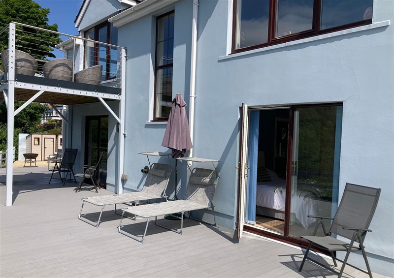 Enjoy a glass of wine on the patio at 1 Bryn Beudy, Stepaside