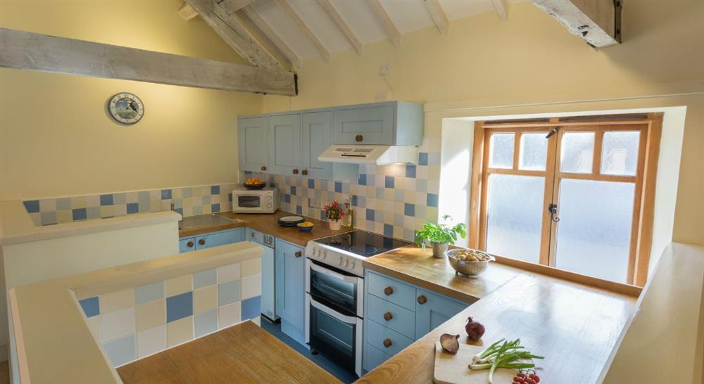 The country kitchen at 1 Cart Lodge Barn in Upper Sheringham, Norfolk