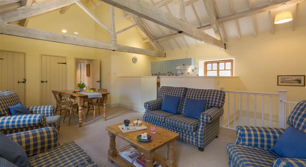 The large sitting dining room at 1 Cart Lodge Barn in Upper Sheringham, Norfolk