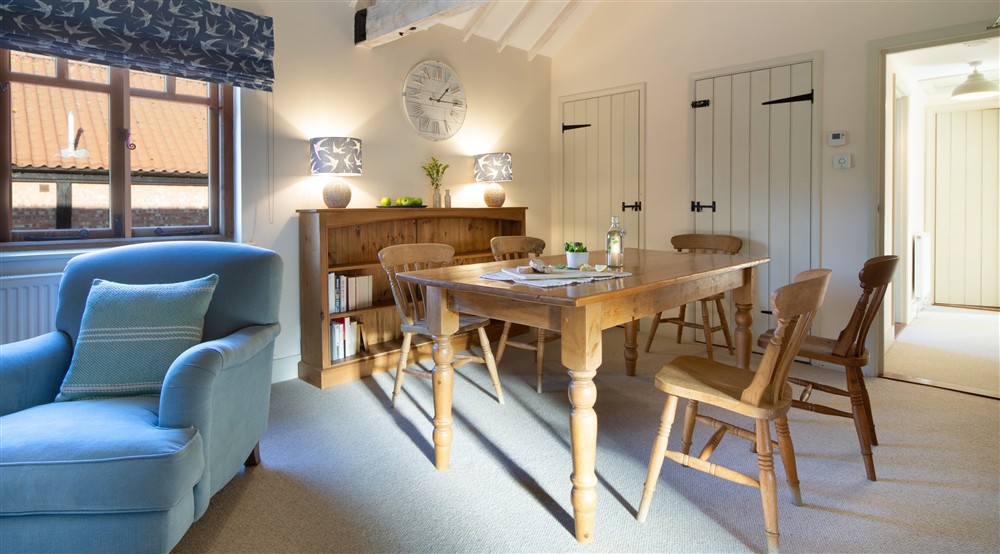 The sitting and dining room (photo 2) at 1 Cart Lodge Barn in Upper Sheringham, Norfolk