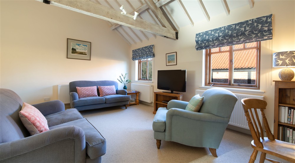 The sitting and dining room (photo 3) at 1 Cart Lodge Barn in Upper Sheringham, Norfolk