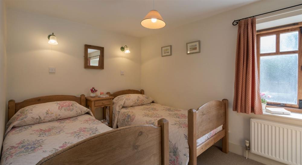 The spacious twin bedroom at 1 Cart Lodge Barn in Upper Sheringham, Norfolk