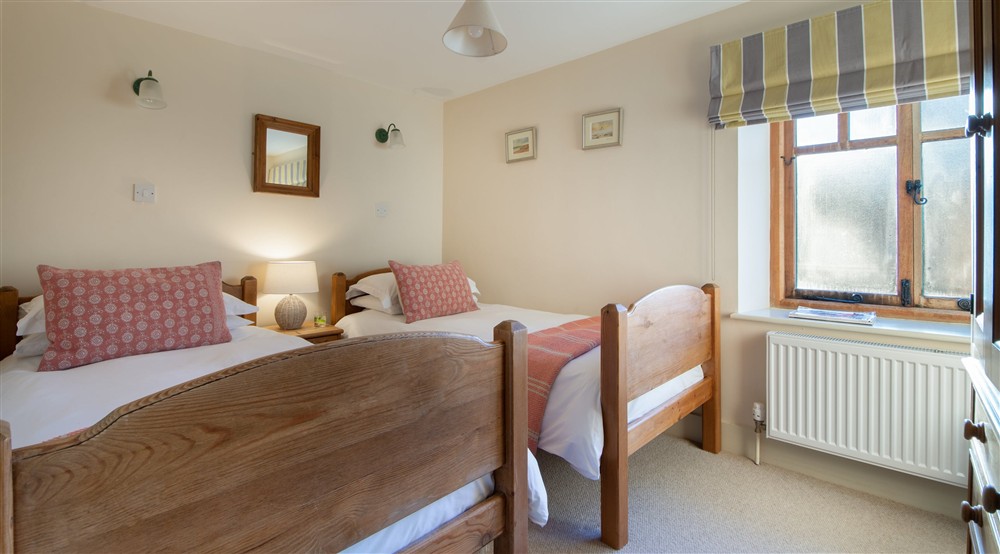 The twin bedroom at 1 Cart Lodge Barn in Upper Sheringham, Norfolk