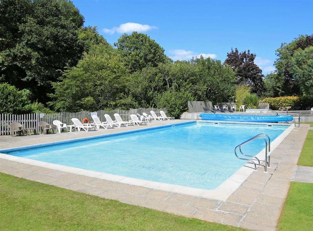 Outdoor swimming pool at 1 Castle Cottage in Bow Creek, Nr Totnes, South Devon., Great Britain