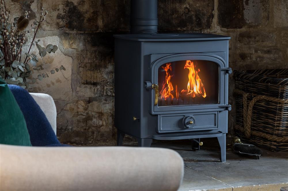 Enjoy the warmth of the wood burning stove on cooler evenings at 1 Chestnut Corner, Stanton, Broadway