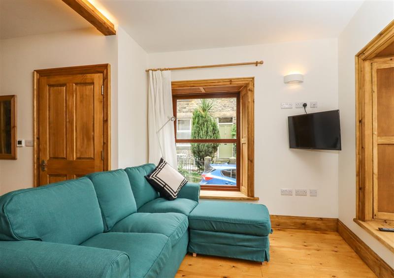 Relax in the living area at 1 Chews Cottage, Pateley Bridge