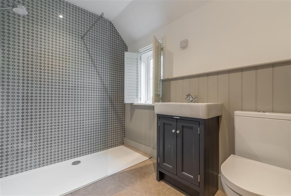 First floor family shower room with walk in shower, wash basin and WC at 1 Church Cottages and Garden Room, Westmeston