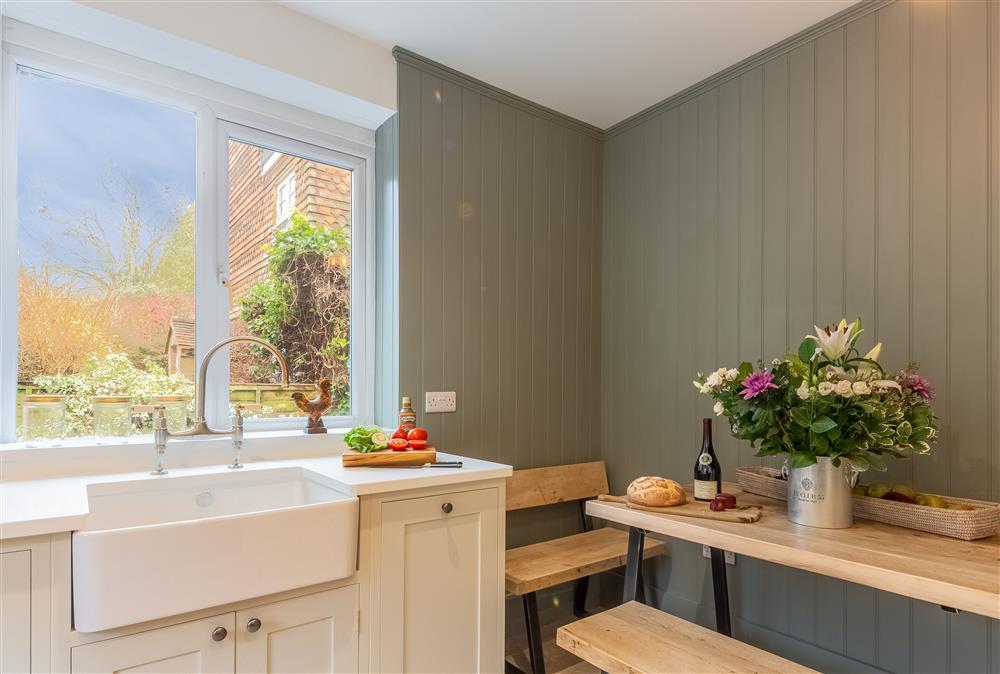 Ground floor kitchen with breakfast table and bench seats at 1 Church Cottages and Garden Room, Westmeston