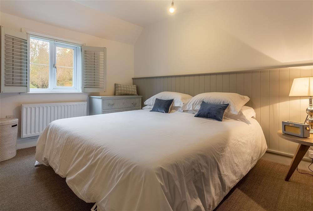 Bedroom two with 6’ super-king size bed at 1 Church Cottages, Westmeston
