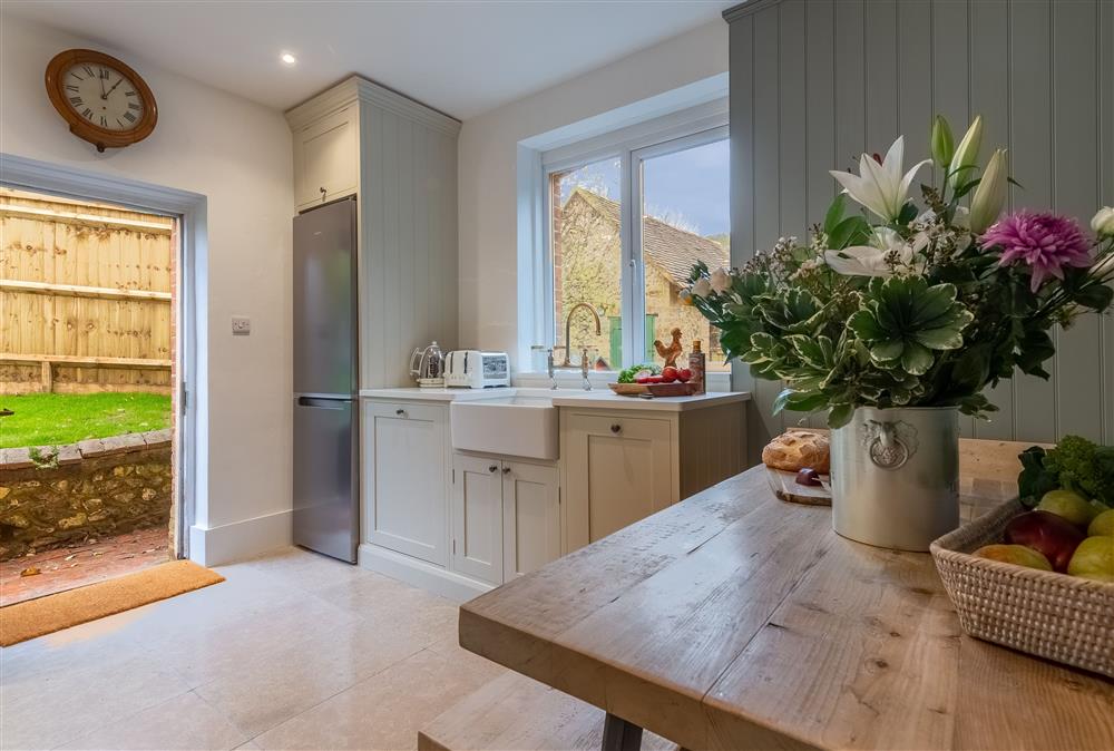 Kitchen with breakfast table and bench seats at 1 Church Cottages, Westmeston