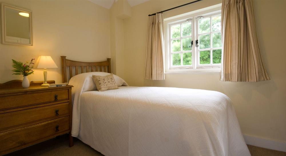 One of the two single bedrooms at 1 Coleton Barton in Dartmouth, Devon