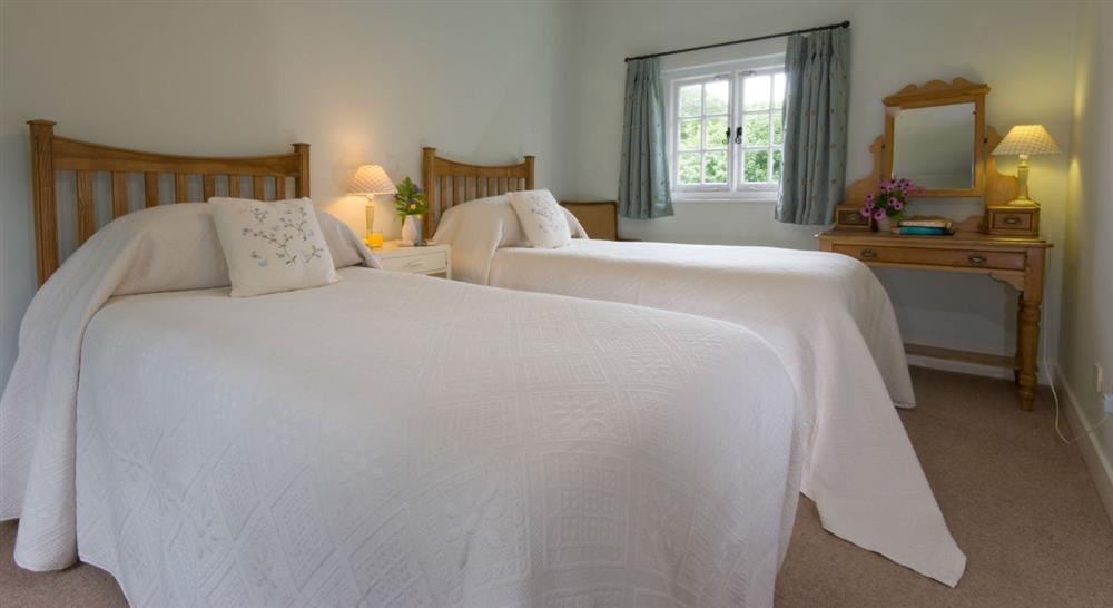 The large twin bedroom at 1 Coleton Barton in Dartmouth, Devon