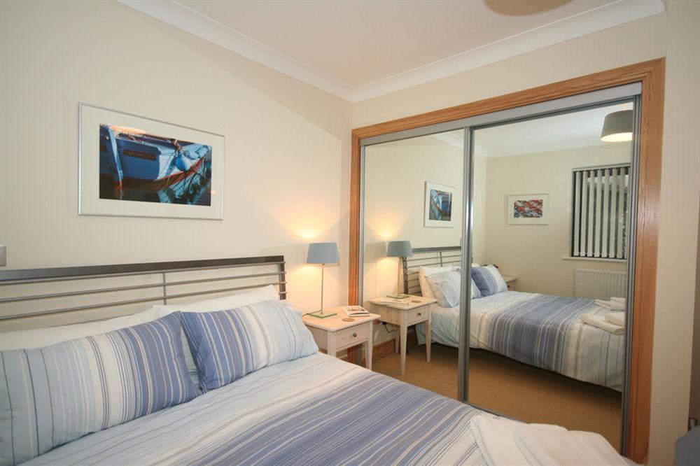 Second bedroom also has built-in mirrored wardrobes at 1 Crabshell Quay in Embankment Road, Kingsbridge
