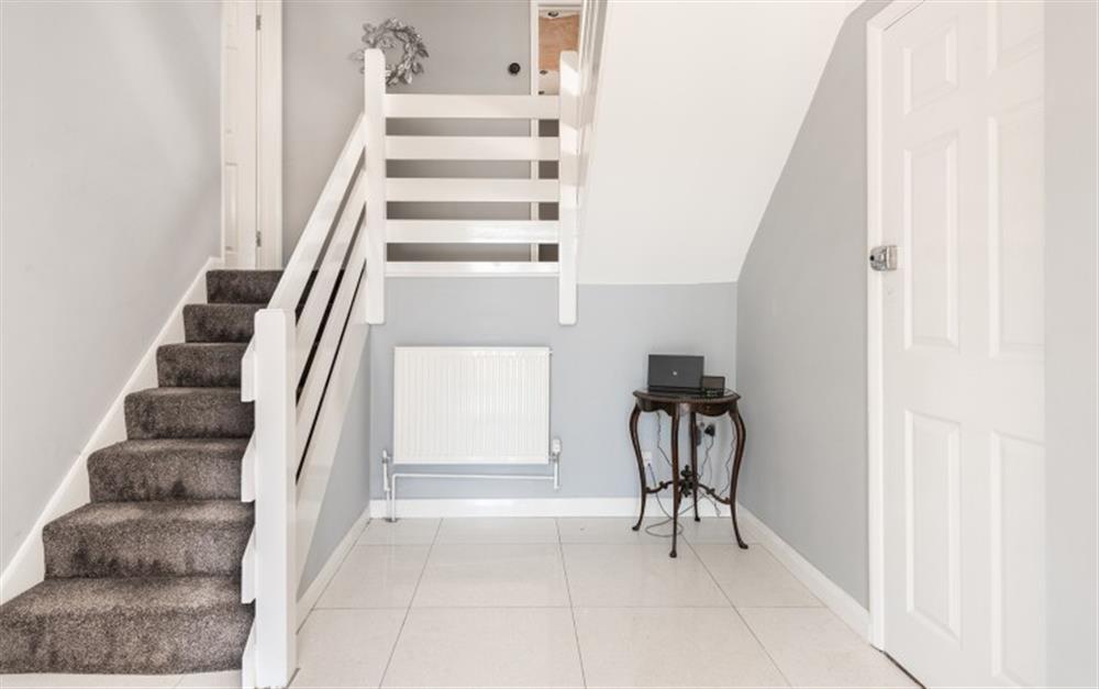 The inner hall with stairs up to the main living areas at 1 Crestfields in Strete