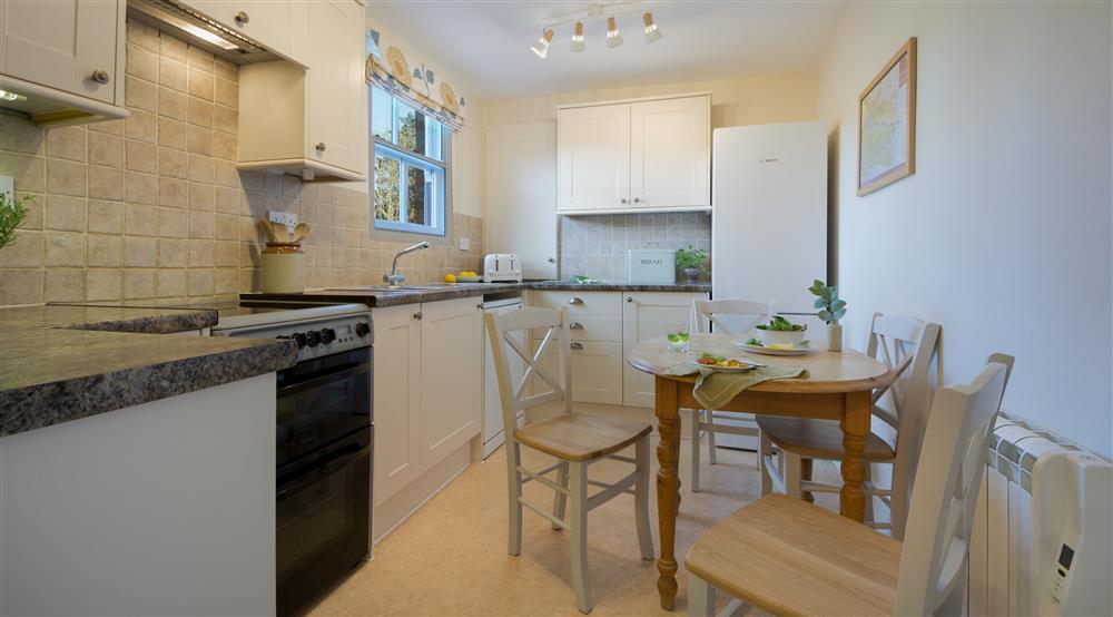 The kitchen and dining room at 1 Currendon Cottages in Swanage, Dorset