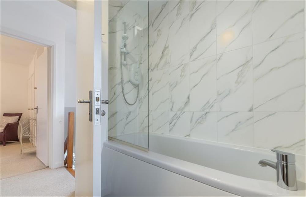 First floor: Bathroom with shower over bath at 1 Dix Cottages, Thornham near Hunstanton
