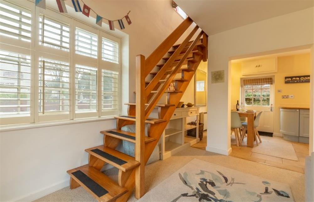 Ground floor: Open tread oak stairs to the first floor at 1 Dix Cottages, Thornham near Hunstanton