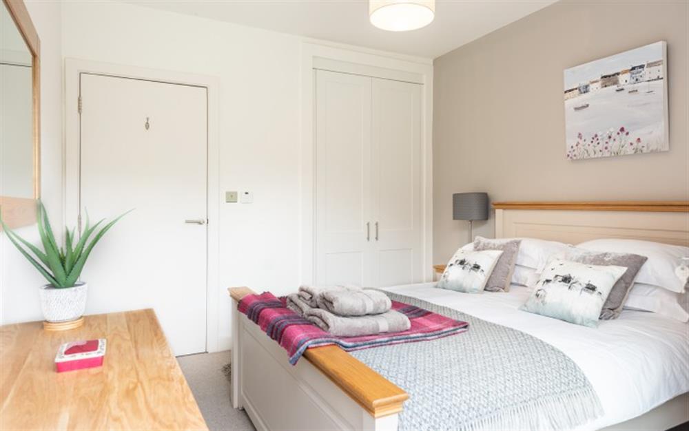 Bedroom 2 with king size bed and built-in wardrobe. at 1 Dufour in East Allington