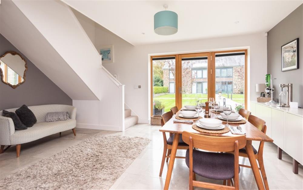 Large dining area with doors leading to private patio area. at 1 Dufour in East Allington