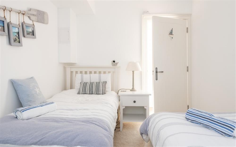The pretty twin bedroom at 1 Edith Mews in Hallsands