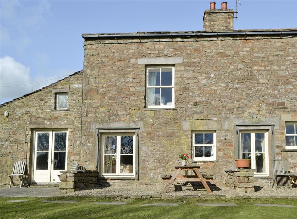 Rear external and outdoor seating area at 1 Gill Edge Cottages in Bainbridge, near Hawes, North Yorkshire