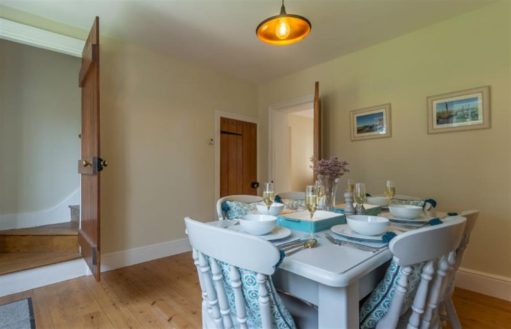 Ground floor: Dining room with stairs up to first floor at 1 Hall Lane Cottages, Thornham  near Hunstanton