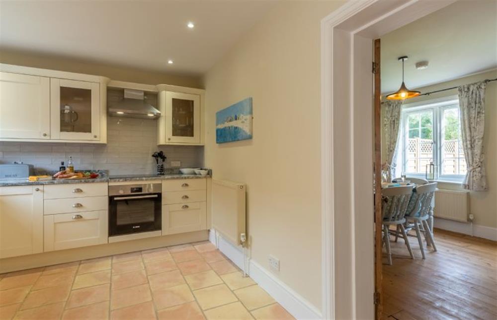 Ground floor: Kitchen, with a view of the dining room at 1 Hall Lane Cottages, Thornham  near Hunstanton