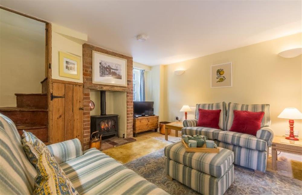 1 Honeymoon Row: Sitting room with comfy sofas at 1 Honeymoon Row, Wells-next-the-Sea