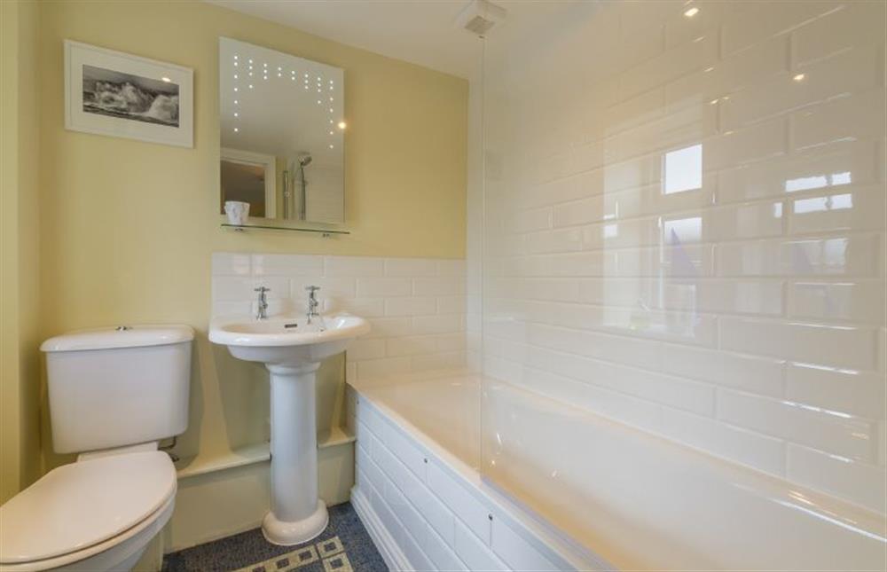 First floor: Bathroom with bath with shower over at 1 Honeymoon Row, Wells-next-the-Sea