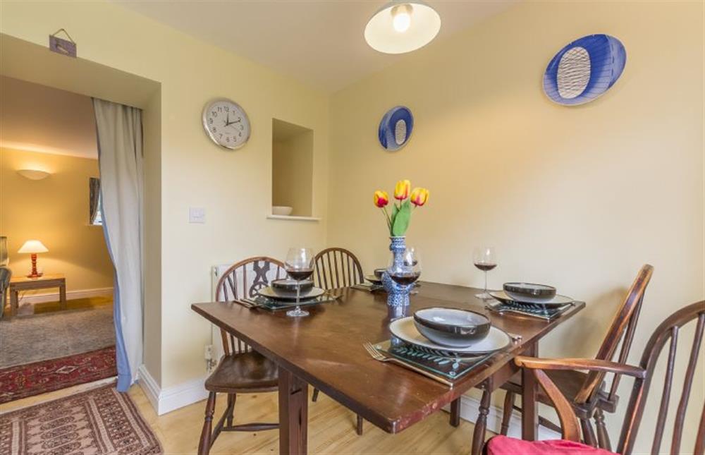 Ground floor: Dining area leading into the sitting room at 1 Honeymoon Row, Wells-next-the-Sea