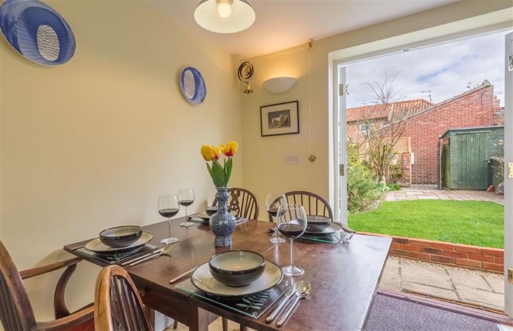 Ground floor: Dining room with french doors leading into the garden at 1 Honeymoon Row, Wells-next-the-Sea