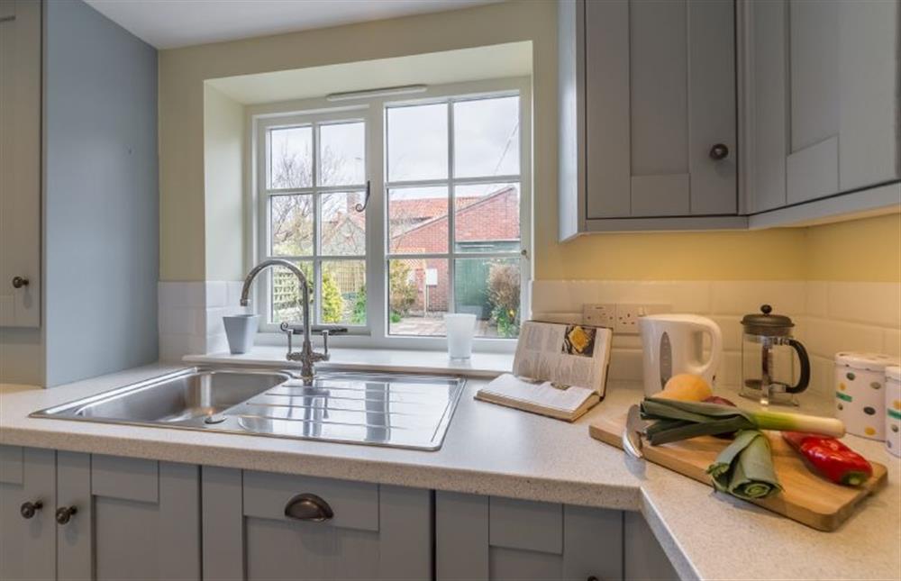 Ground floor: Kitchen with views out into the garden at 1 Honeymoon Row, Wells-next-the-Sea