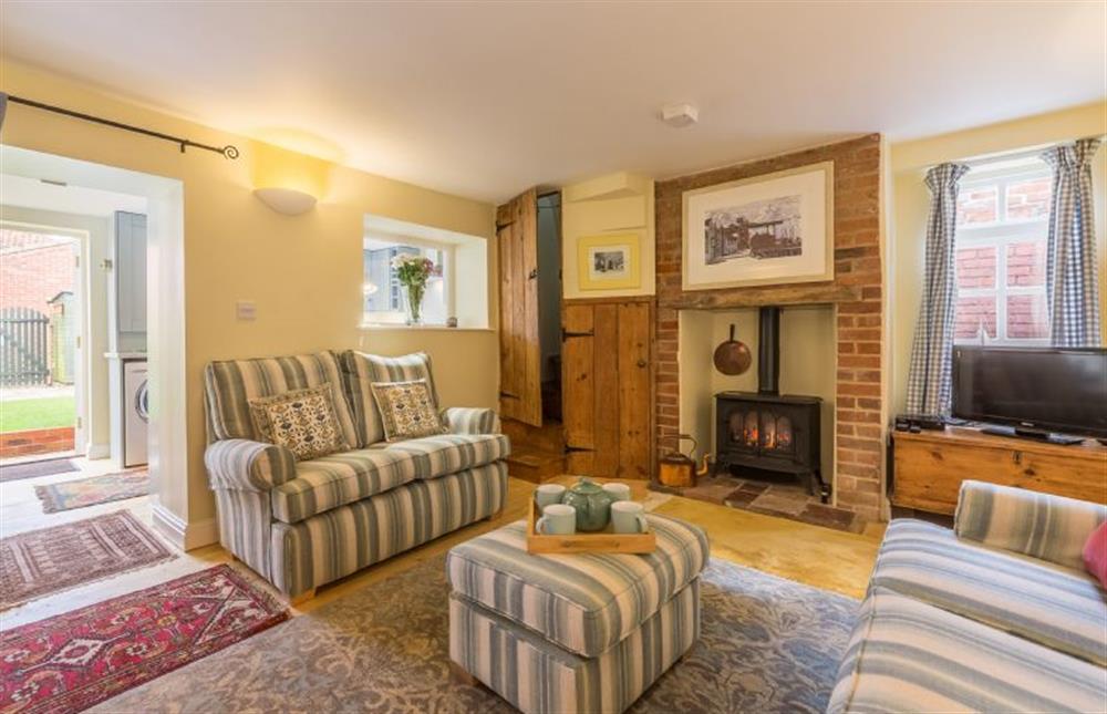 Ground floor: Sitting room with gas fire at 1 Honeymoon Row, Wells-next-the-Sea