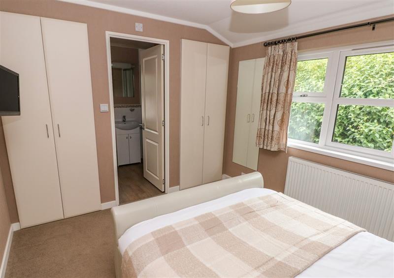 A bedroom in 1 Hornbeam Lodge at 1 Hornbeam Lodge, Narberth
