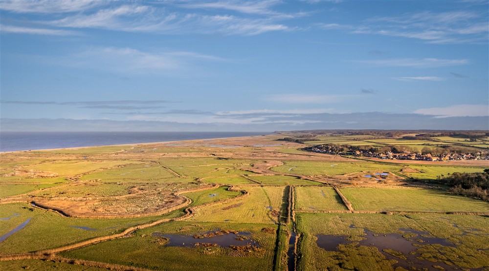 An aerial view of the marshes and coast near Blakeney Lodge, Norfolk. at 1 Horsey Barns in Horsey, Norfolk