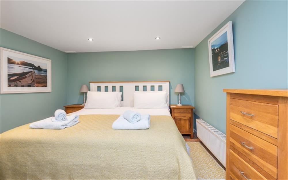 Bedroom 2 - ground floor room with super kingsize bed and adjacent shower room. at 1 Kings Cottages in Salcombe