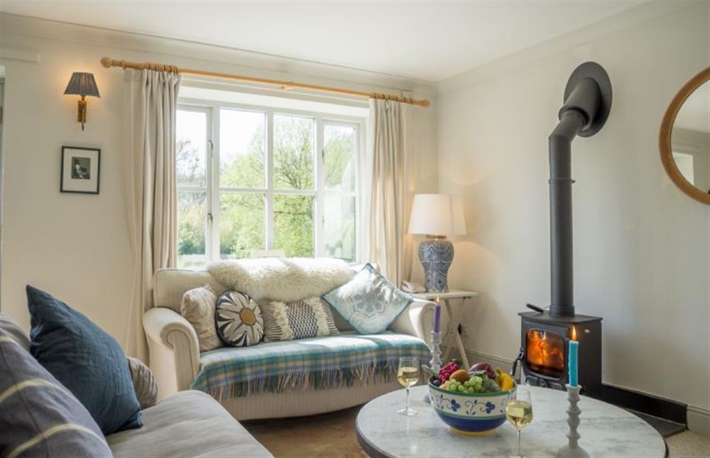 1 Mallard Cottages has a cosy living area with wood burning stove at 1 Mallard Cottages, Tattersett near Kings Lynn
