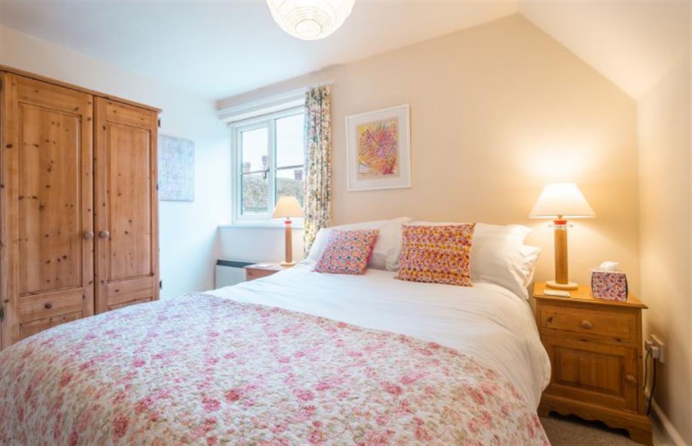 Bedroom one with double bed at 1 Market Hill, Orford
