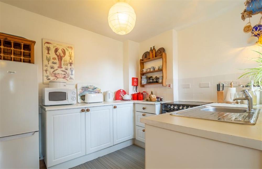 Kitchen with fridge freezer and microwave at 1 Market Hill, Orford
