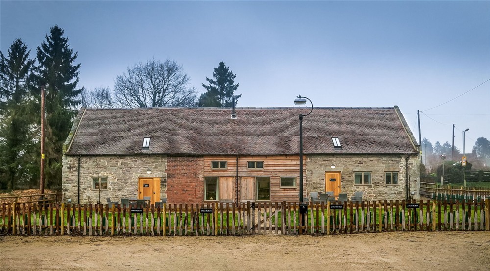 The exterior of 1 Morville Barn on the left,