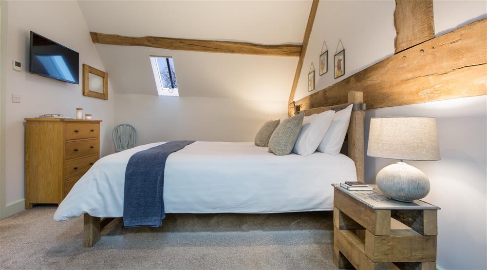 The first king-sized bedroom at 1 Morville Barn in Morville, Shropshire