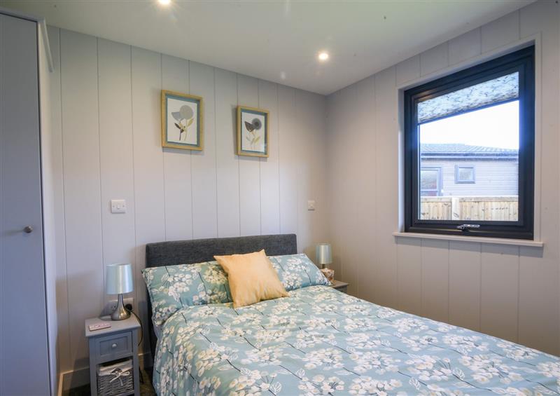 A bedroom in 1 Pinewood Retreat at 1 Pinewood Retreat, Lyme Regis