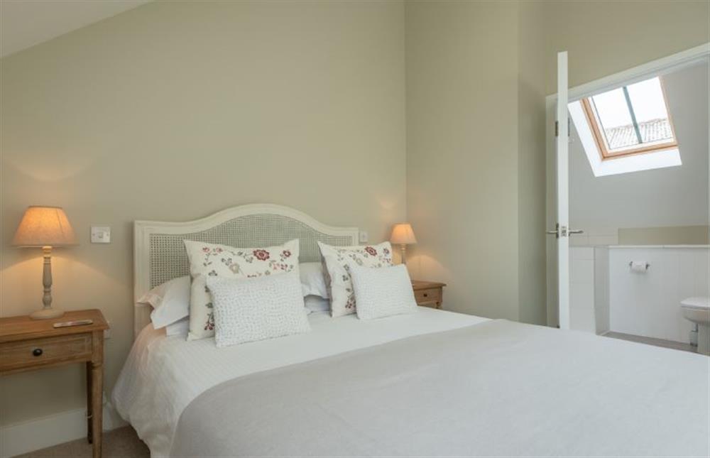 First Floor: Master bedroom with door to en-suite at 1 Railway Cottages, Holt