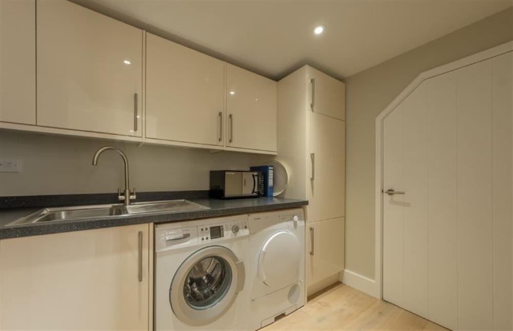 Ground floor: Utility with washing machine and tumble dryer at 1 Railway Cottages, Holt