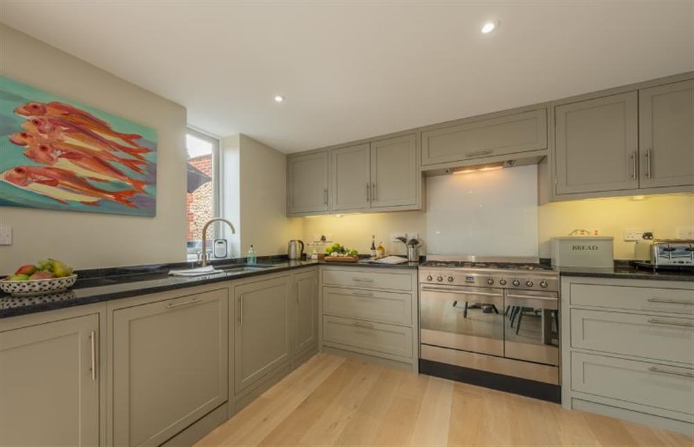 Ground floor: Well-equipped kitchen with gas range cooker, microwave, fridge/freezer and dishwasher at 1 Railway Cottages, Holt