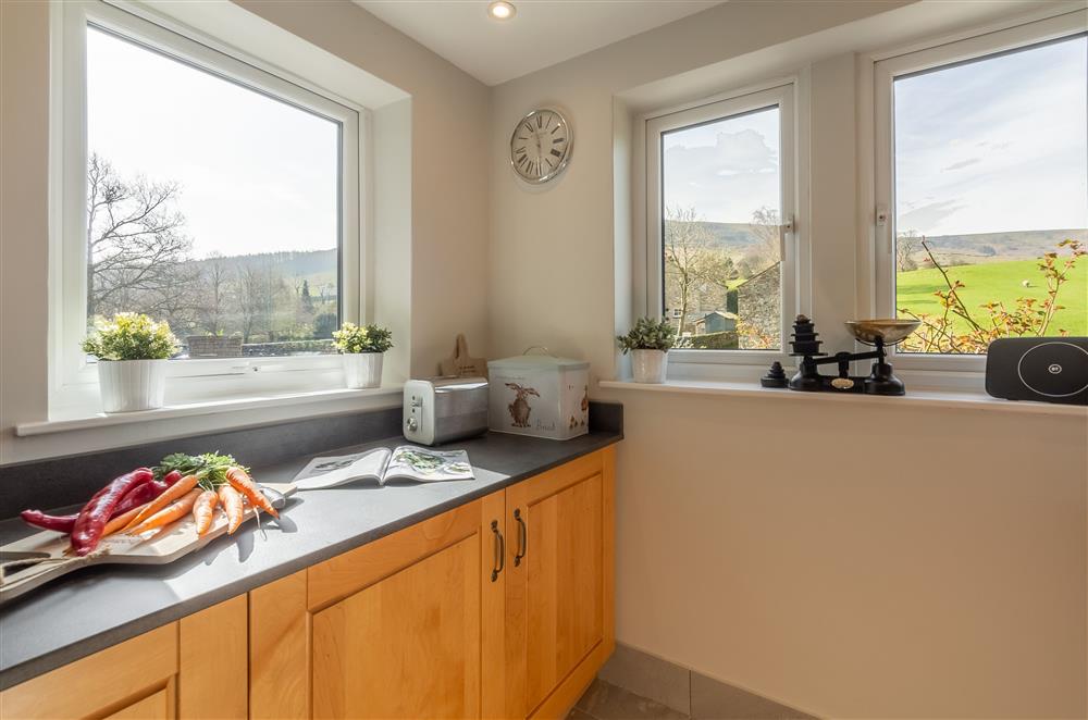 Kitchen with views of the hills at 1 Riverside Cottage, Burnsall