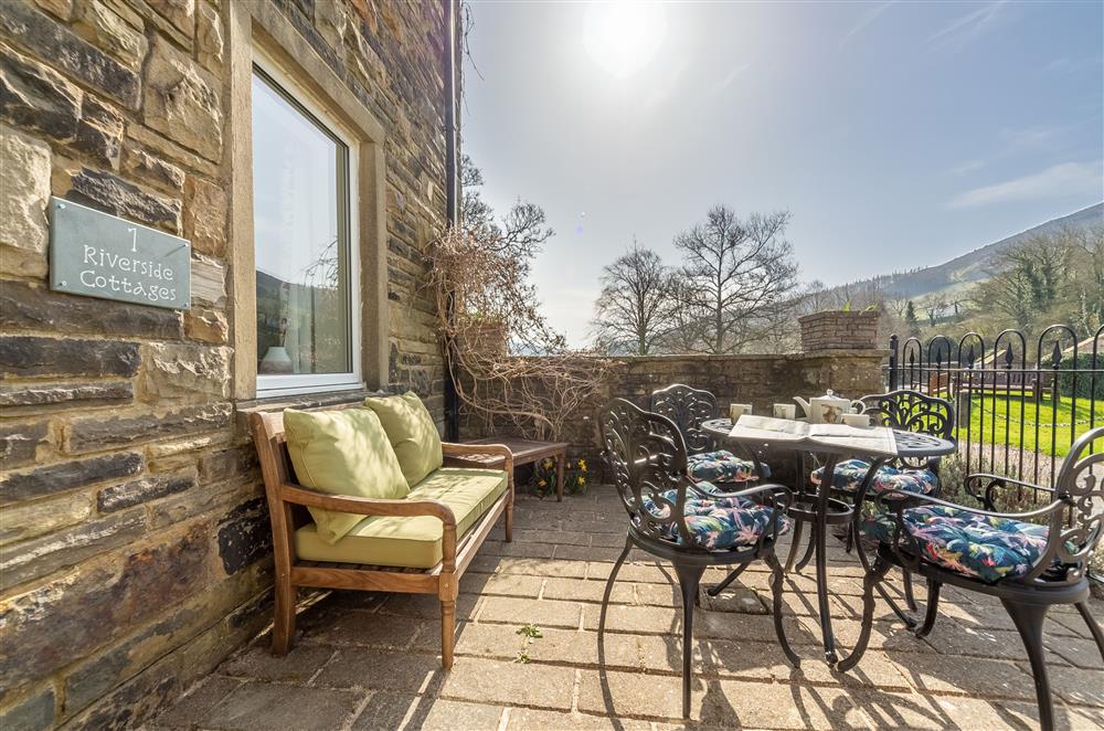 Patio seating area and a beautiful view (photo 2) at 1 Riverside Cottage, Burnsall